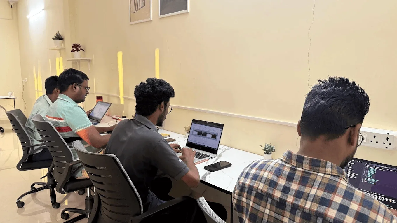 Noukha Technologies team members working together in modern office